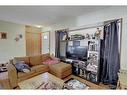 2219 38 Street Se, Calgary, AB  - Indoor Photo Showing Living Room 