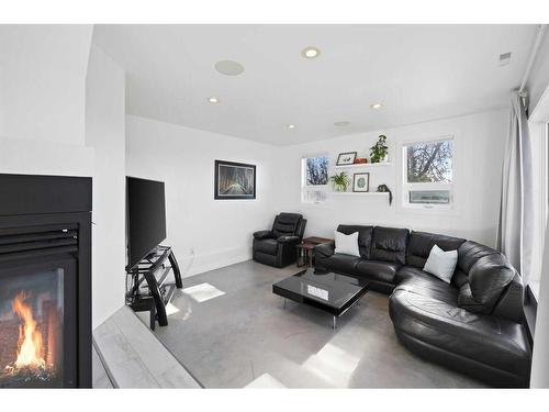 70 Cochrane Crescent, Cochrane, AB - Indoor Photo Showing Living Room With Fireplace