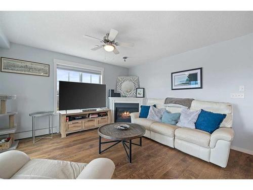 1311-99 Copperstone Park Se, Calgary, AB - Indoor Photo Showing Living Room With Fireplace