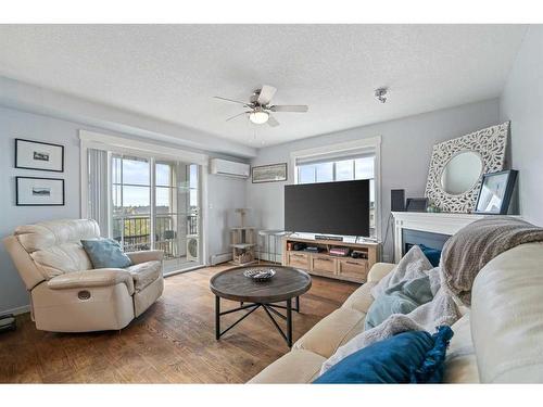 1311-99 Copperstone Park Se, Calgary, AB - Indoor Photo Showing Living Room