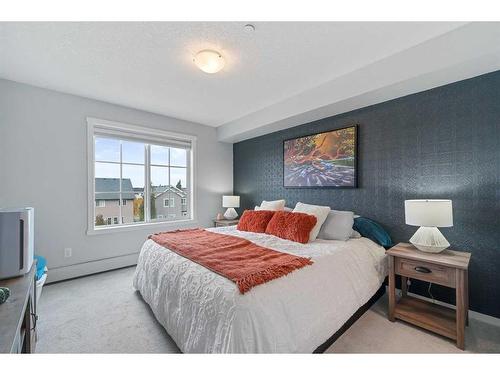 1311-99 Copperstone Park Se, Calgary, AB - Indoor Photo Showing Bedroom