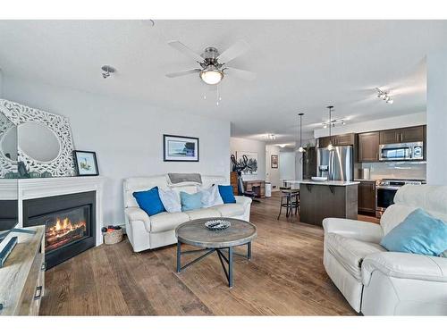 1311-99 Copperstone Park Se, Calgary, AB - Indoor Photo Showing Living Room With Fireplace