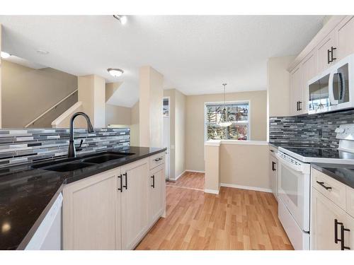 124 Promenade Way Se, Calgary, AB - Indoor Photo Showing Kitchen With Double Sink With Upgraded Kitchen