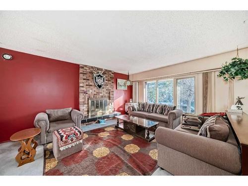 255 Rundleridge Drive Ne, Calgary, AB - Indoor Photo Showing Living Room With Fireplace