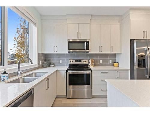 614 Redstone Crescent Ne, Calgary, AB - Indoor Photo Showing Kitchen With Double Sink With Upgraded Kitchen