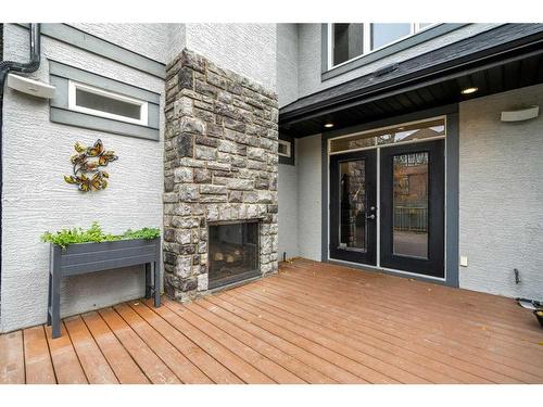 34 Cranarch Circle Se, Calgary, AB - Outdoor With Fireplace With Deck Patio Veranda With Exterior