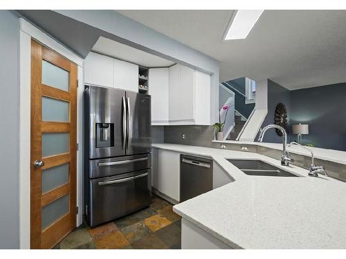 16 Everwoods Road Sw, Calgary, AB - Indoor Photo Showing Kitchen With Double Sink