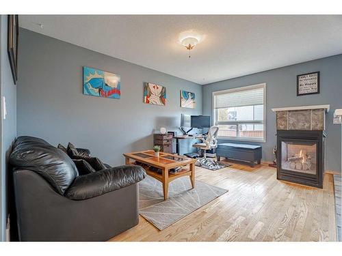 259 Coral Springs Mews Ne, Calgary, AB - Indoor Photo Showing Living Room With Fireplace