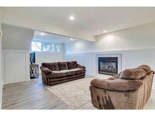 120 Willowbrook Close Nw, Airdrie, AB - Indoor Photo Showing Living Room With Fireplace