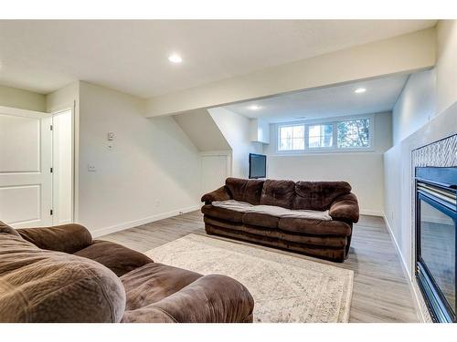 120 Willowbrook Close Nw, Airdrie, AB - Indoor Photo Showing Other Room With Fireplace