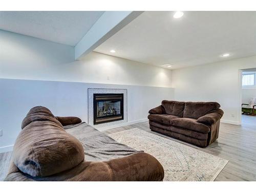 120 Willowbrook Close Nw, Airdrie, AB - Indoor With Fireplace