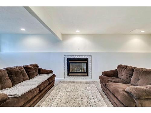 120 Willowbrook Close Nw, Airdrie, AB - Indoor Photo Showing Living Room With Fireplace