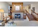 258 Shawnessy Drive Sw, Calgary, AB  - Indoor Photo Showing Living Room With Fireplace 