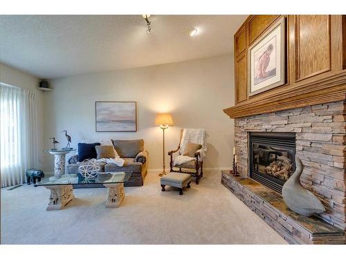 258 Shawnessy Drive Sw, Calgary, AB - Indoor Photo Showing Living Room With Fireplace