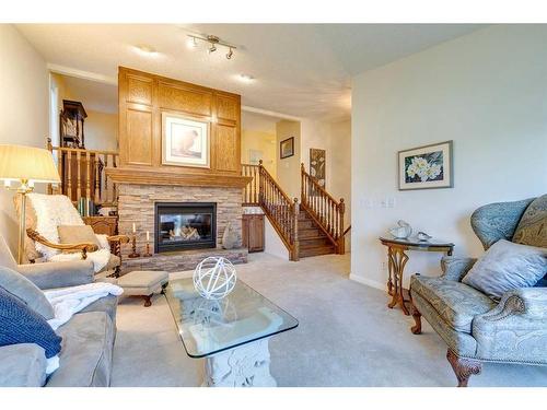 258 Shawnessy Drive Sw, Calgary, AB - Indoor Photo Showing Living Room With Fireplace