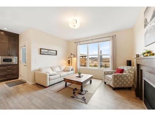 85 Fireside Circle, Cochrane, AB - Indoor Photo Showing Living Room With Fireplace