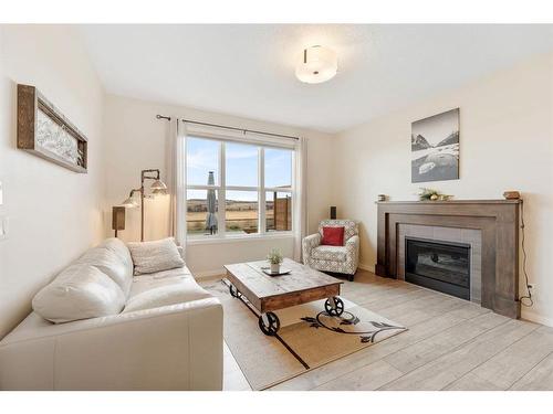 85 Fireside Circle, Cochrane, AB - Indoor Photo Showing Living Room With Fireplace