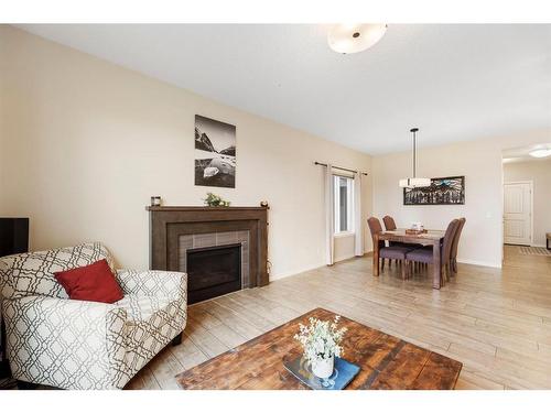 85 Fireside Circle, Cochrane, AB - Indoor Photo Showing Living Room With Fireplace