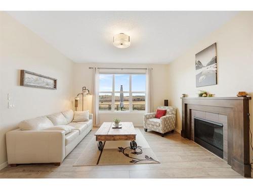 85 Fireside Circle, Cochrane, AB - Indoor Photo Showing Living Room With Fireplace