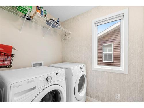 85 Fireside Circle, Cochrane, AB - Indoor Photo Showing Laundry Room