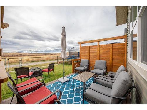 85 Fireside Circle, Cochrane, AB - Outdoor With Deck Patio Veranda With Exterior