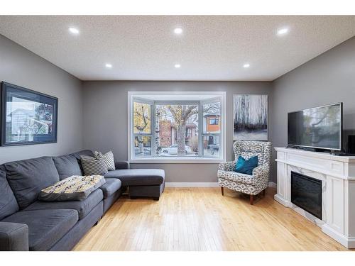 530 53 Avenue Sw, Calgary, AB - Indoor Photo Showing Living Room With Fireplace