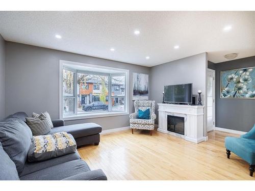 530 53 Avenue Sw, Calgary, AB - Indoor Photo Showing Living Room With Fireplace