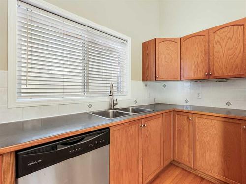 99 Eversyde Circle Sw, Calgary, AB - Indoor Photo Showing Kitchen With Double Sink