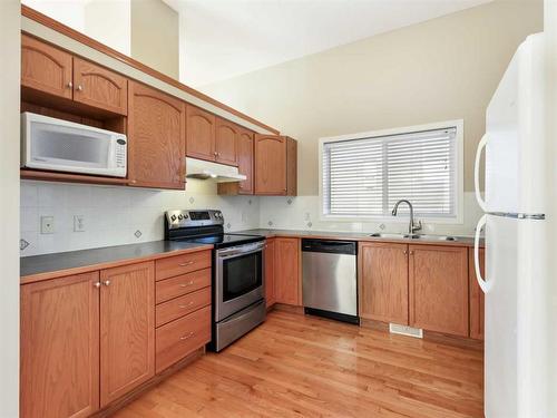 99 Eversyde Circle Sw, Calgary, AB - Indoor Photo Showing Kitchen With Double Sink