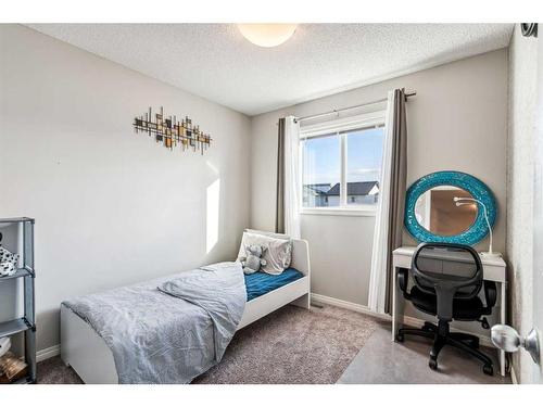 41 Copperpond Avenue Se, Calgary, AB - Indoor Photo Showing Bedroom