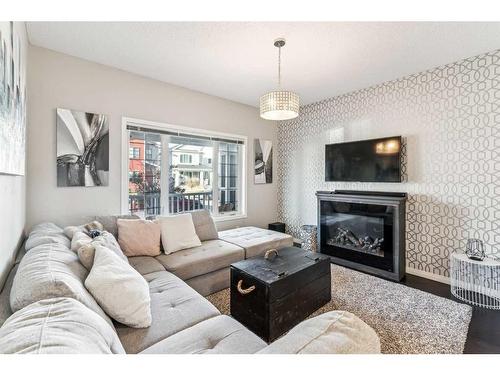 41 Copperpond Avenue Se, Calgary, AB - Indoor Photo Showing Living Room With Fireplace