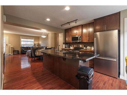 209 Aspen Hills Villas Sw, Calgary, AB - Indoor Photo Showing Kitchen With Stainless Steel Kitchen