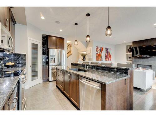 222 Aspen Stone Way Sw, Calgary, AB - Indoor Photo Showing Kitchen With Stainless Steel Kitchen With Double Sink With Upgraded Kitchen