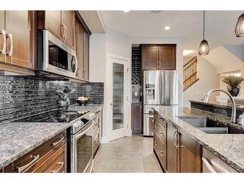 222 Aspen Stone Way Sw, Calgary, AB - Indoor Photo Showing Kitchen With Stainless Steel Kitchen With Double Sink With Upgraded Kitchen