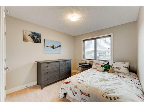 222 Aspen Stone Way Sw, Calgary, AB - Indoor Photo Showing Bedroom