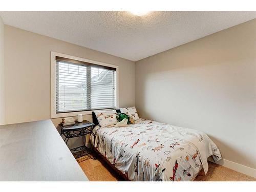 222 Aspen Stone Way Sw, Calgary, AB - Indoor Photo Showing Bedroom