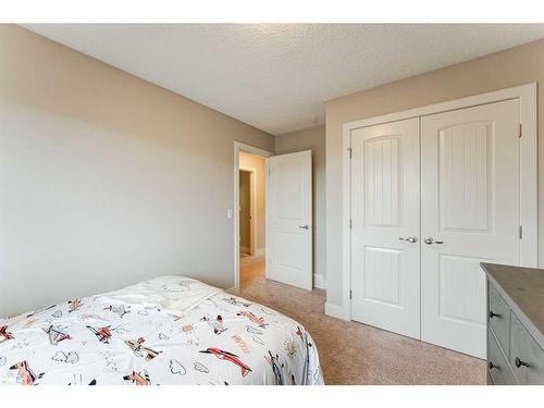 222 Aspen Stone Way Sw, Calgary, AB - Indoor Photo Showing Bedroom