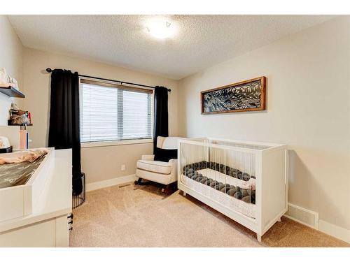 222 Aspen Stone Way Sw, Calgary, AB - Indoor Photo Showing Bedroom