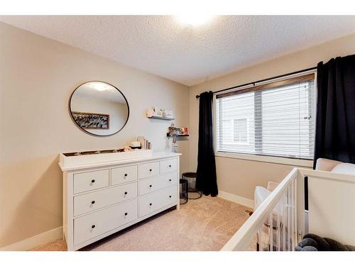 222 Aspen Stone Way Sw, Calgary, AB - Indoor Photo Showing Bedroom