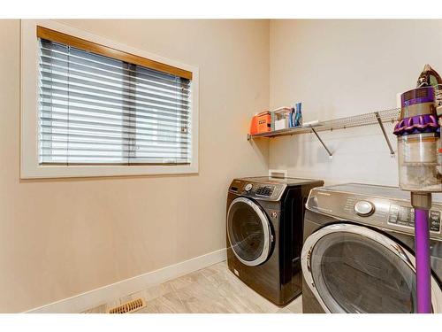 222 Aspen Stone Way Sw, Calgary, AB - Indoor Photo Showing Laundry Room