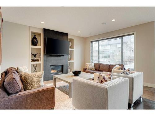 222 Aspen Stone Way Sw, Calgary, AB - Indoor Photo Showing Living Room With Fireplace