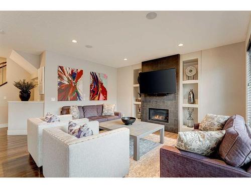 222 Aspen Stone Way Sw, Calgary, AB - Indoor Photo Showing Living Room With Fireplace