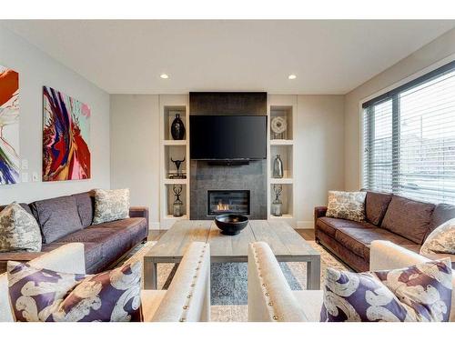 222 Aspen Stone Way Sw, Calgary, AB - Indoor Photo Showing Living Room With Fireplace