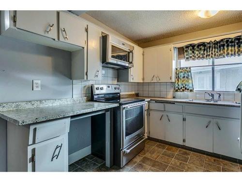 201 Penbrooke Close Se, Calgary, AB - Indoor Photo Showing Kitchen With Double Sink