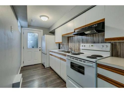 201 Penbrooke Close Se, Calgary, AB - Indoor Photo Showing Kitchen With Double Sink