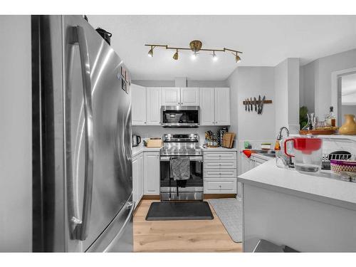 216-6000 Somervale Court Sw, Calgary, AB - Indoor Photo Showing Kitchen With Stainless Steel Kitchen With Double Sink