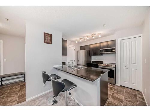 319-195 Kincora Glen Road Nw, Calgary, AB - Indoor Photo Showing Kitchen With Double Sink