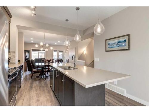 207 Sage Bluff Drive Nw, Calgary, AB - Indoor Photo Showing Kitchen With Double Sink With Upgraded Kitchen