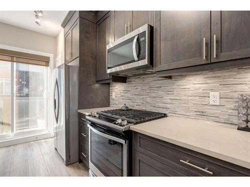 207 Sage Bluff Drive Nw, Calgary, AB - Indoor Photo Showing Kitchen With Upgraded Kitchen