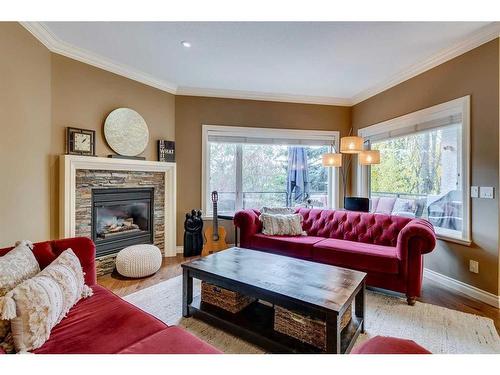 347 Sierra Madre Court Sw, Calgary, AB - Indoor Photo Showing Living Room With Fireplace